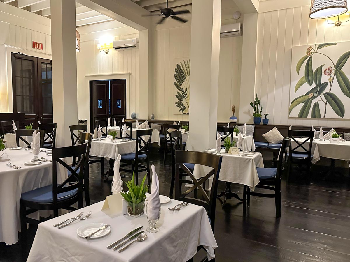 Long view of the restaurant - white table cloths and napkins