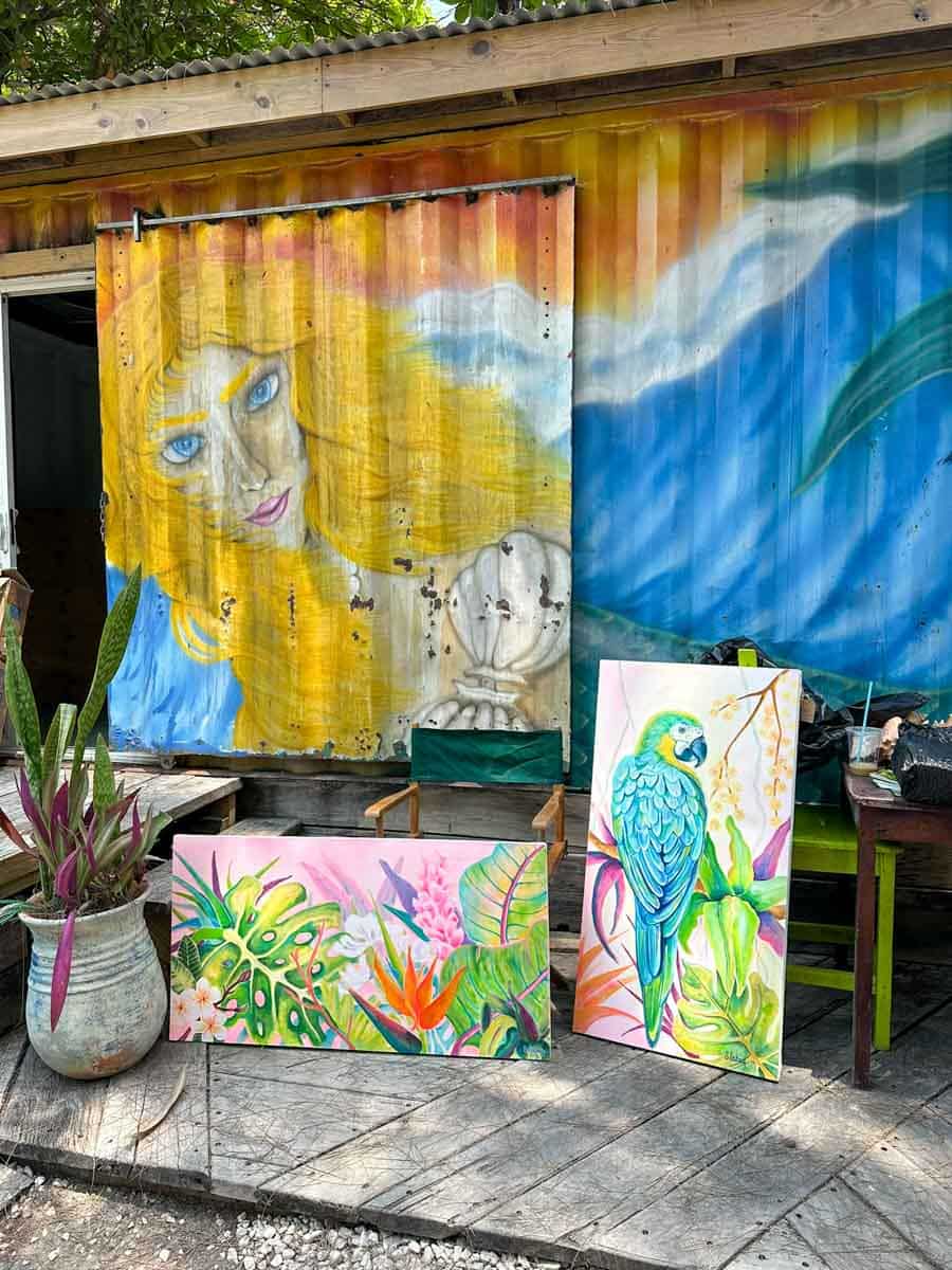Pretty paintings of flowers and a parrot