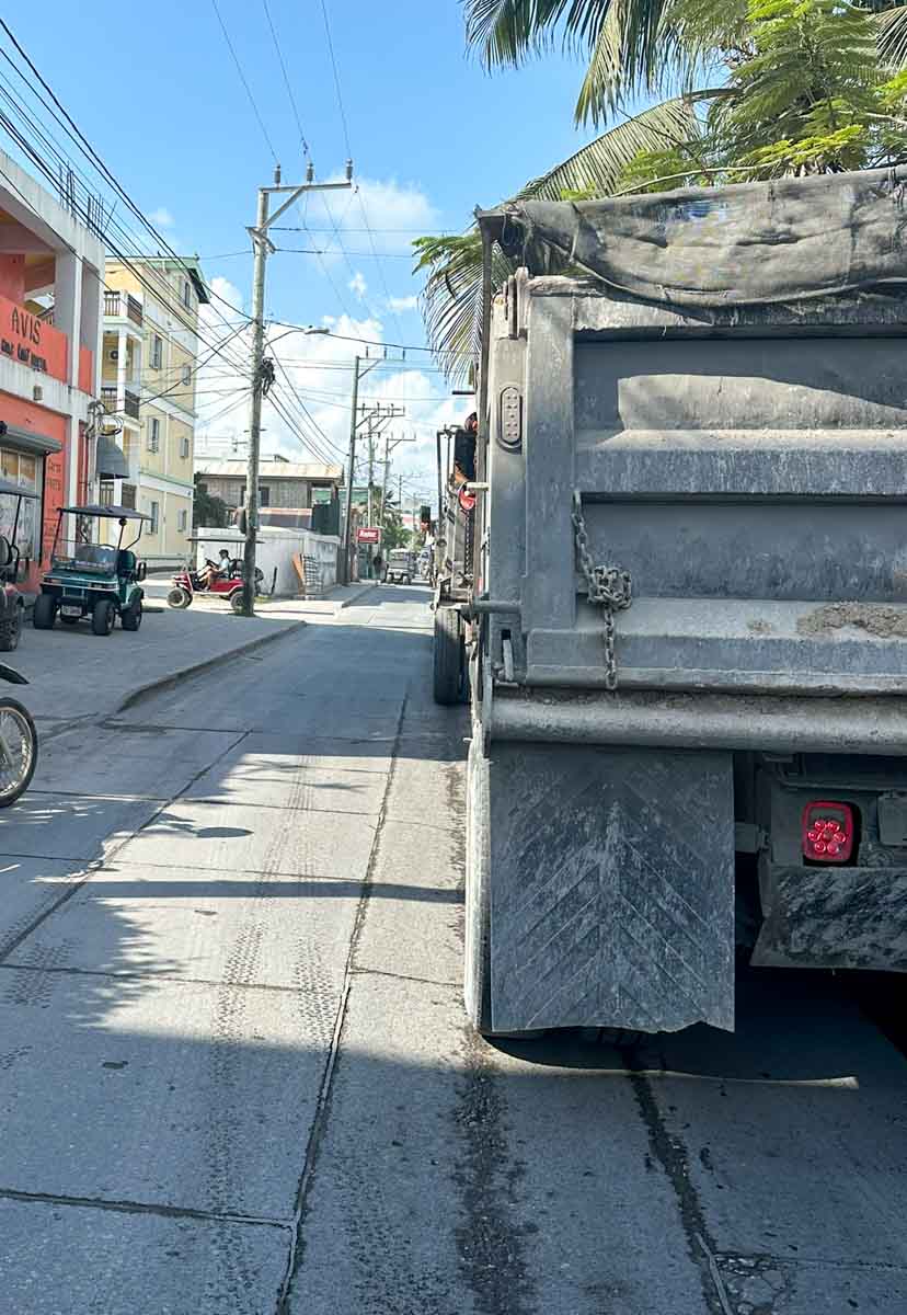 Waiting behind dump trucks
